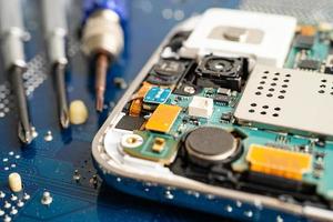 Repairing and upgrade mobile phone, electronic, computer hardware and technology concept. photo