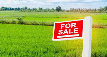 Land for sale sign, real estate residence purchase payment, home loan concept. photo
