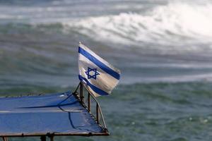 The blue and white flag of Israel with the six-pointed Star of David. photo