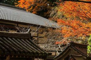 Autumn scene of Kurama-dera, a temple situated at the base of Mount Kurama in the far north of Kyoto Prefecture, Kansai, Japan photo