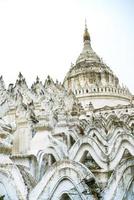 Hsinbyume Pagoda, or Myatheindan Pagoda, white pagoda modeled on physical description of the Buddhist mythological mountain, Mount Meru, located on western bank of Irrawaddy river, Mingun, Sagaing photo