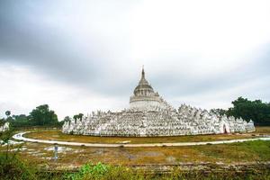 Hsinbyume Pagoda, or Myatheindan Pagoda, white pagoda modeled on physical description of the Buddhist mythological mountain, Mount Meru, located on western bank of Irrawaddy river, Mingun, Sagaing photo