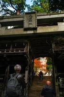 Kurama, Kyoto Prefecture, Kansai, Japan - November 21, 2019 - Tourists visit to Yuki-jinja, a famous Shinto shrine on the grounds of Kurama temple, a temple situated at the base of Mount Kurama photo