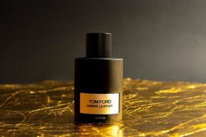 Tom Ford ombre leather parfum on gold background, Yerevan, Armenia - 2022 Oct 08 photo