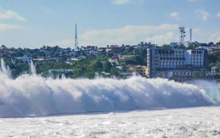 Extremely huge big surfer waves at beach Puerto Escondido Mexico. photo