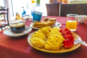 Fresh breakfast with pineapple watermelon orange juice toast Phuket Thailand. photo