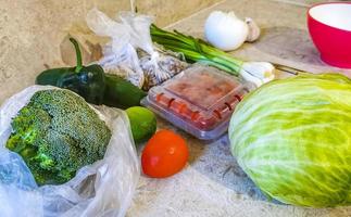 Preparing a salad with cucumber tomato greens broccoli Mexico. photo