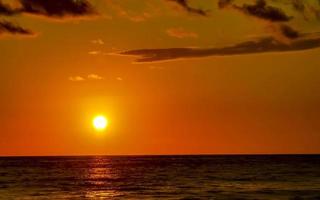 Colorful golden sunset big wave and beach Puerto Escondido Mexico. photo