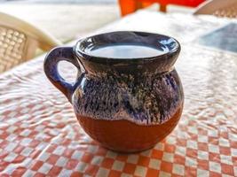 Cup of americano black coffee in restaurant Mexico. photo