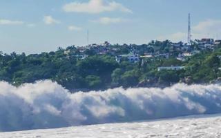 Extremely huge big surfer waves at beach Puerto Escondido Mexico. photo