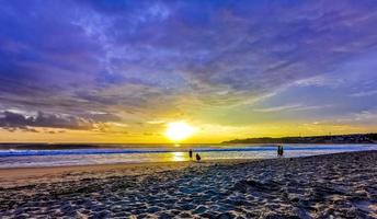 Colorful golden sunset big wave and beach Puerto Escondido Mexico. photo