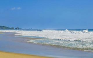 Extremely huge big surfer waves at beach Puerto Escondido Mexico. photo