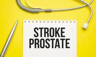 Stroke PROSTATE text on the notebook next to it is a stethoscope photo