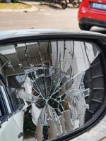 A car's right side rearview mirror was broken when it was hit by another vehicle photo