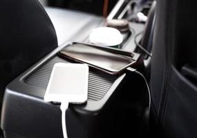 Plug to charge mobile phone in the car.Phone charging cable focus photo