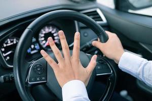 The driver is honking the horn to prevent an accident. photo