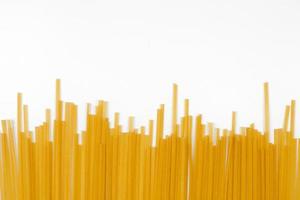 Uncooked spaghetti, bunch of italian pasta photo