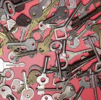 Keys set on pink background. Door lock keys and safes for proper photo