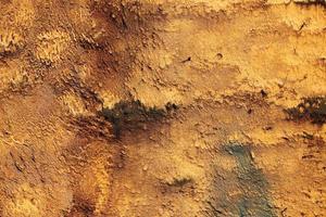 Abstract background of rough yellow wall texture, vibrant photo