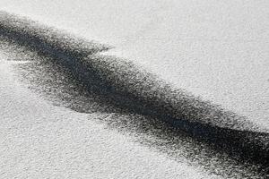 Abstract black line on snow-white background. Cracked ice photo