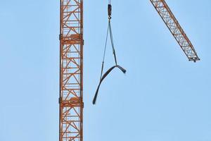 Construction crane working on building complex photo