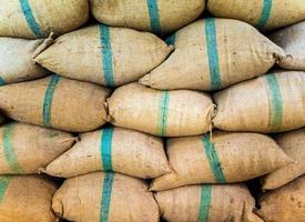 Rice in sacks stacked up a lot photo