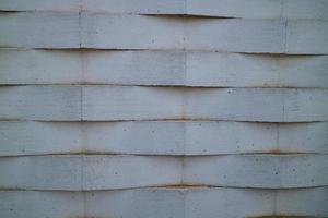 wall of white bricks arranged in a zig zag photo