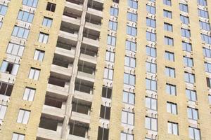 Windows of building on new residential area construction site. Industry modern civil house business. Concept of development improvement town. Architecture planning of a city. Renovation project. photo