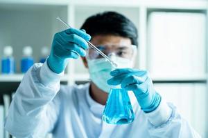 male scientist, laboratory specialist working with test tubes scientist. Chemist. Science technology concept. Chemistry and medical science research study concepts. Medical Research. photo