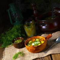 Polish sour cucumber soup with dill photo