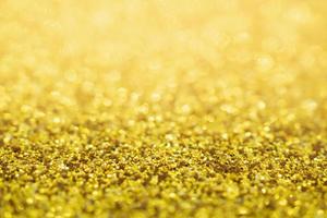 Abstract Gold glitter festive Christmas texture background blur with bokeh light photo