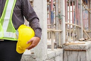 professional engineer worker at the house building construction site photo