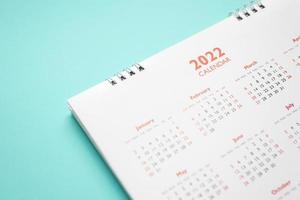 2022 calendar page on blue background business planning appointment meeting concept photo