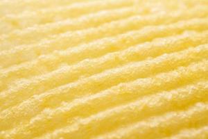 Potato chip texture background closeup photo