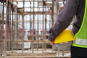 professional engineer worker at the house building construction site photo