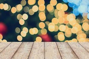 Christmas holiday background with empty wooden table photo