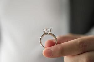 hand hold beautiful jewelry diamond ring photo