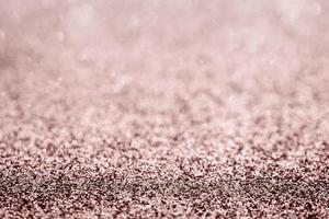 Abstract rose gold glitter sparkle texture with bokeh background photo