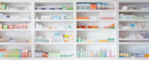 Pharmacy drugstore blur abstract backbround with medicine and healthcare product on shelves photo