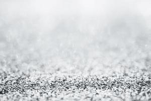 Abstract silver glitter sparkle texture with bokeh background photo