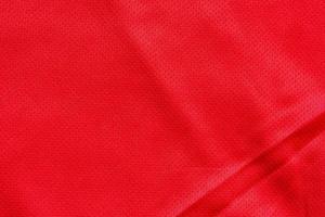 Red sports clothing fabric football shirt jersey texture background photo