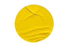 Yellow round paper sticker label isolated on white background photo