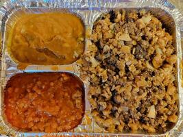 spicy beef and beans Ethiopian food in metal tray photo