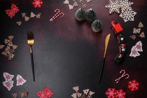 Christmas decoration elements as well as gingerbread on a brown concrete background photo