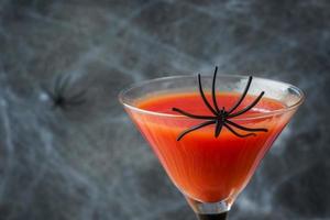 Bloody Mary cocktail, spider web background for Halloween, selective focus Copy space photo