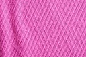 Pink cotton fabric texture closeup background photo