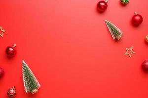 Christmas new year holiday background pine tree ball bauble on red background photo