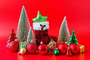 Christmas tree and baubles on red background new year  holiday celebration concept photo