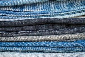 denim blue jeans stack texture background closeup photo