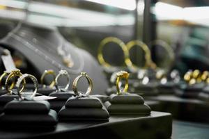 Jewelry diamond rings and necklaces show in luxury retail store window display photo